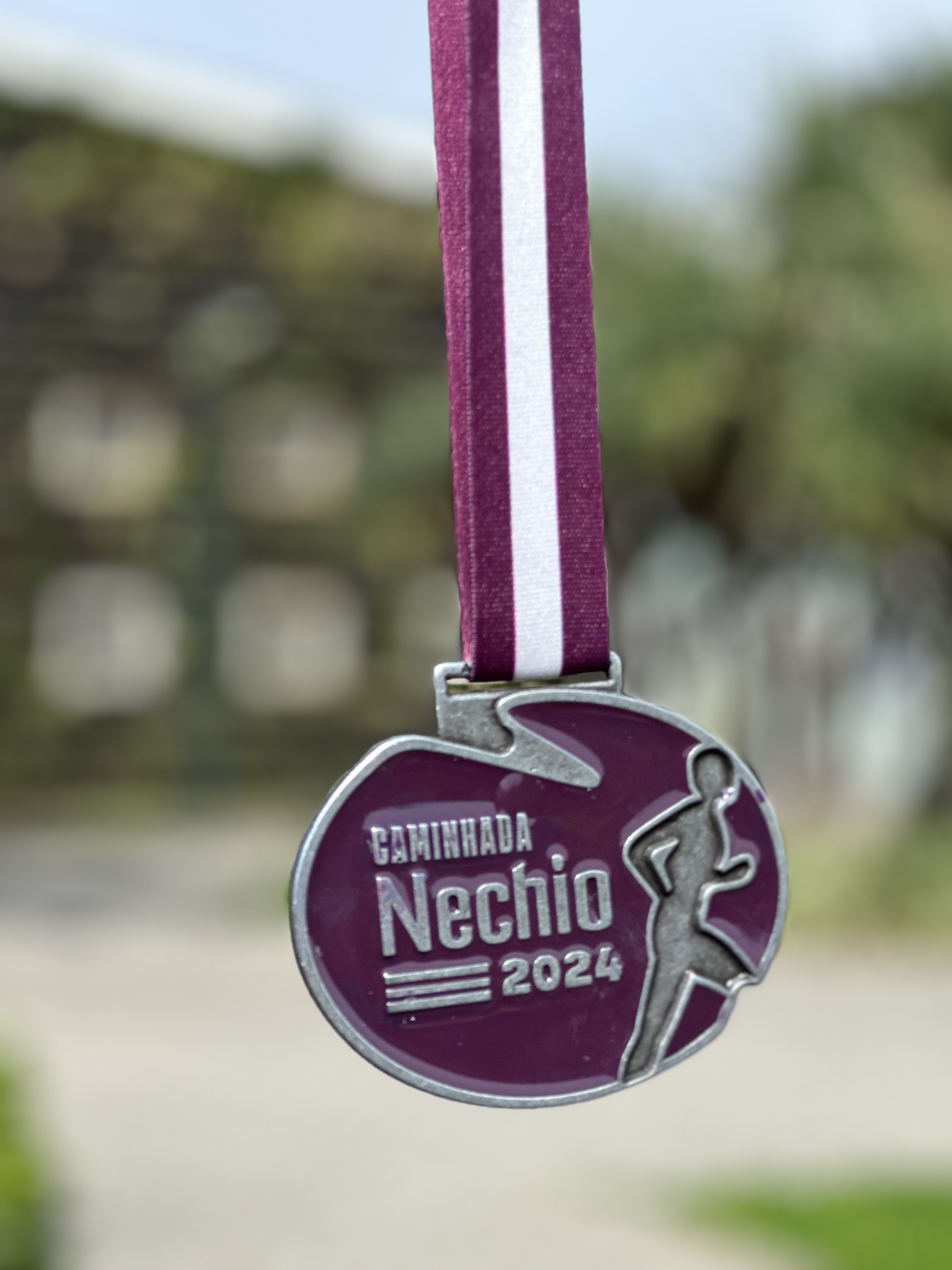 Participante com medalha na chegada